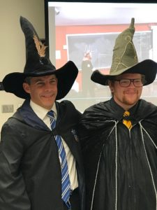 Two men in wizards' robes and hats